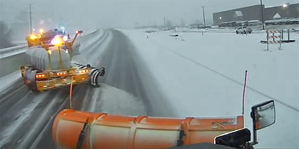 Photo: Out the front window of a snowplow in Savage.